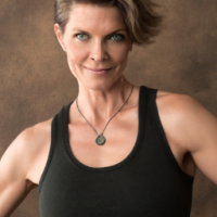 woman late 30's appearing to be in great physical shape just a shoulder up picture for a profile picture facing the camera