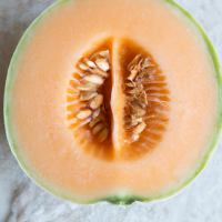 fresh cut cantaloupe in half in full view